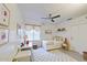 A cozy bedroom with playful decor, a comfortable bed, and a window with natural light at 9967 W Devonshire Ave, Phoenix, AZ 85037