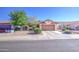Charming single-story home with a two-car garage, desert landscaping, and mature trees for a suburban feel at 9967 W Devonshire Ave, Phoenix, AZ 85037