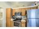 Clean kitchen with stainless steel appliances and plenty of cabinet space for storage at 9967 W Devonshire Ave, Phoenix, AZ 85037