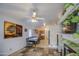 Open concept dining room featuring slate tile floors, an eat-in kitchen, fireplace and lots of natural light at 9967 W Devonshire Ave, Phoenix, AZ 85037