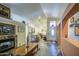 Cozy living room with tile floors, fireplace, neutral walls, and ample space for personalization at 9967 W Devonshire Ave, Phoenix, AZ 85037