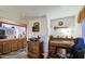 Office area with hardwood floors, desk, and shelving at 9967 W Devonshire Ave, Phoenix, AZ 85037