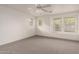 Bright, carpeted bedroom with multiple windows providing natural light at 999 S Sabino Dr, Gilbert, AZ 85296
