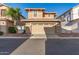 Charming two-story home with a well-maintained front yard, a two car garage, and sidewalk appeal at 999 S Sabino Dr, Gilbert, AZ 85296
