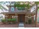 Inviting two-story home featuring a covered porch and well-manicured landscaping at 999 S Sabino Dr, Gilbert, AZ 85296