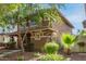 Two-story home with tidy landscaping, including trimmed bushes and mulch ground cover at 999 S Sabino Dr, Gilbert, AZ 85296