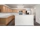 Well-lit kitchen with light wood cabinets and stainless steel appliances at 999 S Sabino Dr, Gilbert, AZ 85296