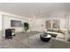 Bright living room features tile floors, a ceiling fan, neutral colored walls, and plenty of room to relax at 999 S Sabino Dr, Gilbert, AZ 85296