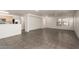Bright living room showcasing tile floors and natural light from front-facing windows at 999 S Sabino Dr, Gilbert, AZ 85296