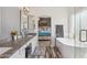 Elegant bathroom with granite countertops, double sinks, soaking tub, and tiled floors at 1014 S Porter St, Gilbert, AZ 85296
