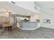 Kitchen with stainless steel appliances, breakfast bar, and dining area at 1014 S Porter St, Gilbert, AZ 85296