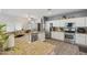 Bright kitchen features stainless steel appliances, granite countertops, and crisp white cabinetry at 1014 S Porter St, Gilbert, AZ 85296