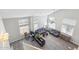 Bright living room with tall ceilings, modern furniture, large windows, and sleek wood floors at 1014 S Porter St, Gilbert, AZ 85296