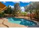 Beautiful pool with pristine water and mature trees provides a serene and private backyard setting at 1014 S Porter St, Gilbert, AZ 85296