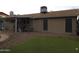 View of the backyard with artificial grass, pool, and patio area perfect for outdoor entertaining at 10201 S 49Th St, Phoenix, AZ 85044