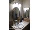 Bathroom featuring tiled counters, framed mirror, and ample lighting at 10201 S 49Th St, Phoenix, AZ 85044