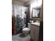 Bathroom featuring a toilet, sink, vanity, and patterned shower curtain at 10201 S 49Th St, Phoenix, AZ 85044