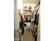 Walk-in closet offering ample storage space and well-organized shelving and hanging rods at 10201 S 49Th St, Phoenix, AZ 85044