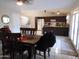 Inviting dining area with dark wood table and chairs next to the kitchen, perfect for Gathering meals at 10201 S 49Th St, Phoenix, AZ 85044