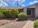 Well-maintained single-story home with mature landscaping, paved walkway, and neutral color palette at 10201 S 49Th St, Phoenix, AZ 85044