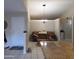 View from kitchen shows the layout, lighting, and easy access to the living areas in the home at 10201 S 49Th St, Phoenix, AZ 85044