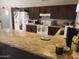 Spacious kitchen featuring granite countertops, ample cabinet space, and modern appliances at 10201 S 49Th St, Phoenix, AZ 85044