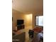 Spacious living room with tile floors, comfortable seating, and a television on a stand at 10201 S 49Th St, Phoenix, AZ 85044