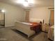 Main bedroom with natural light, neutral paint, and carpet flooring at 10201 S 49Th St, Phoenix, AZ 85044