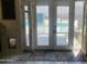 View from inside through an open white patio door with a glimpse of the pool outside at 10201 S 49Th St, Phoenix, AZ 85044