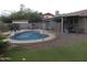 Fenced in pool with a view of putting green, patio, and the main home at 10201 S 49Th St, Phoenix, AZ 85044