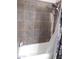 Shower with tile surround and shower head fixture at 10201 S 49Th St, Phoenix, AZ 85044