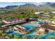 Resort-style community pool area with lazy river, water slides, and mountain views in this desert community at 10239 E Salt Bush Dr, Scottsdale, AZ 85255