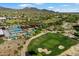Golf course and community pool create opportunities for activities, desert foliage, and mountain views at 10239 E Salt Bush Dr, Scottsdale, AZ 85255