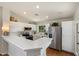 Bright, updated kitchen featuring stainless steel appliances, breakfast bar, and recessed lighting at 10239 E Salt Bush Dr, Scottsdale, AZ 85255