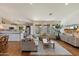 Spacious living area featuring a hardwood floor, recessed lights, and open to the kitchen area at 10239 E Salt Bush Dr, Scottsdale, AZ 85255