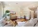 Comfortable living room with built-in features, hardwood flooring, neutral tones, and lots of natural light at 10239 E Salt Bush Dr, Scottsdale, AZ 85255