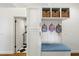 Well-organized mud room with built-in storage, seating, and convenient access to laundry area at 10239 E Salt Bush Dr, Scottsdale, AZ 85255