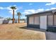 The backyard features two tall palm trees and access to the home at 1027 S Lola Ln, Tempe, AZ 85281