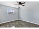 Bright bedroom featuring new hardwood floors and natural light at 1027 S Lola Ln, Tempe, AZ 85281
