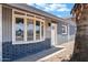 Close-up of the front of the home with a bay window and white front door with the house number at 1027 S Lola Ln, Tempe, AZ 85281