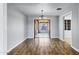 Spacious living room with hardwood floors and view to sun room at 1027 S Lola Ln, Tempe, AZ 85281