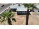 An aerial view of the backyard and the back of the house, complemented by mature palm trees at 1027 S Lola Ln, Tempe, AZ 85281