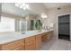Large bathroom featuring an extra long vanity with double sinks and a large mirror at 1028 W Chilton Ave, Gilbert, AZ 85233