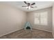 bedroom with carpeted floor and a shuttered window at 1028 W Chilton Ave, Gilbert, AZ 85233