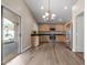 Open kitchen featuring stainless steel appliances, wooden cabinets, and access to the backyard at 1028 W Chilton Ave, Gilbert, AZ 85233