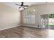 Bright living room with vaulted ceiling, large windows, and sliding door to backyard at 1028 W Chilton Ave, Gilbert, AZ 85233