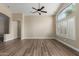 Large room with hard flooring, neutral walls, and large windows offering lots of natural light at 1028 W Chilton Ave, Gilbert, AZ 85233