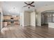 Spacious living area with modern flooring, an open layout, and views into the kitchen at 1028 W Chilton Ave, Gilbert, AZ 85233