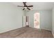 Spacious main bedroom featuring carpeted floors, shuttered windows and ensuite bathroom at 1028 W Chilton Ave, Gilbert, AZ 85233