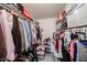 Walk-in closet filled with lots of hanging clothes, shelving, and storage bins at 10401 W Loma Blanca Dr, Sun City, AZ 85351